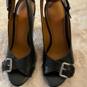 Excellent condition. Black leather peep toe.